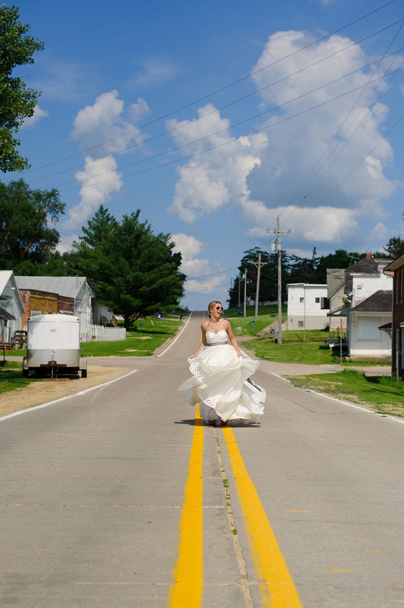 Bride posing in the middle of the road