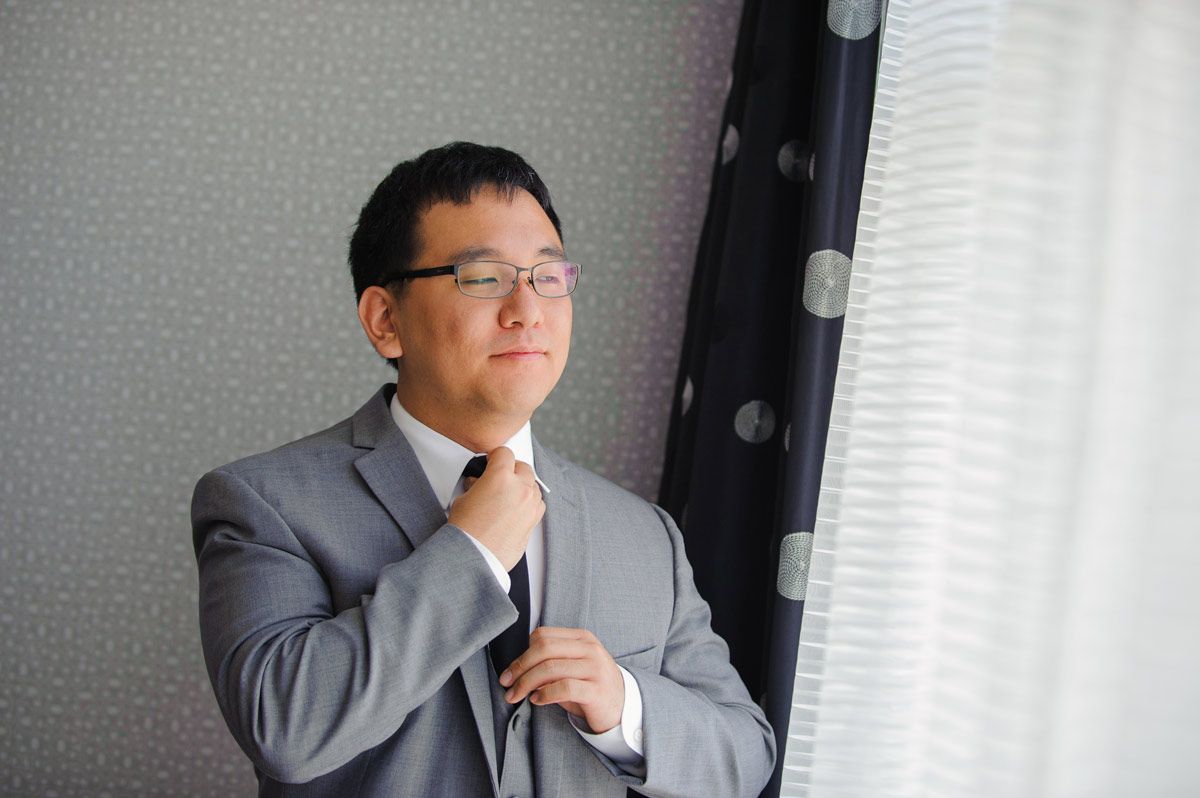 Groom getting ready at the Kirkwood hotel in Cedar Rapids